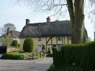 A yellow thatched cottage.