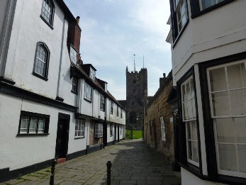 A narrow street leading to the church in Devizes.